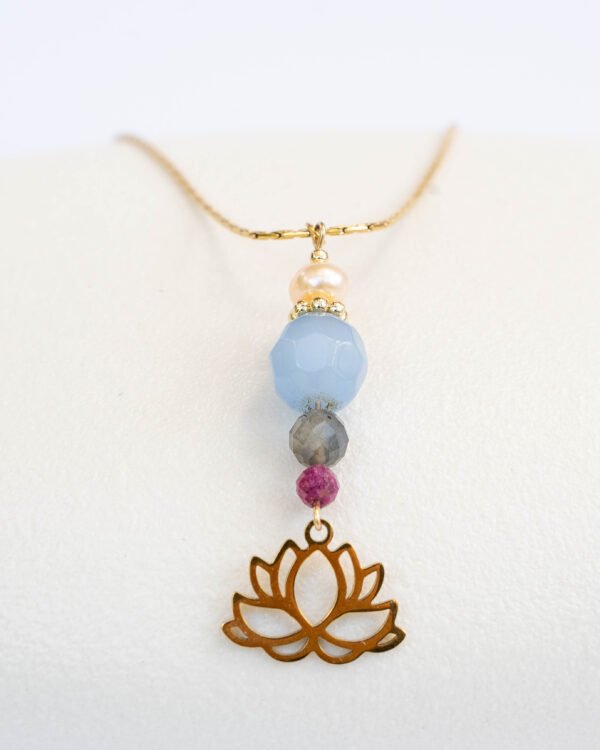Long gold necklace with a pendant designed with ruby, aquamarine, labradorite and pink pearl combined with a lotus