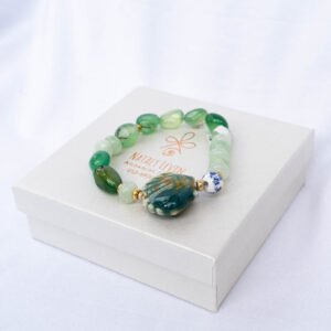 Green aventurine, green jade and ceramic shell bracelet - Image 1