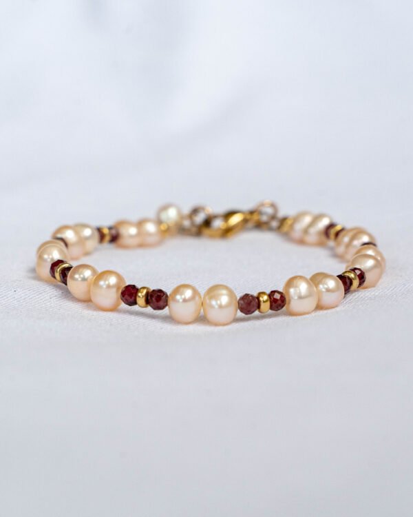 Pink pearl bracelet and gauntlet